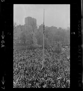 Crowd at State House salute flag at half-mast during protest against US march into Cambodia and the killing of four Ohio students at Kent State