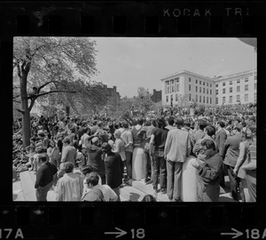 Boston area college students gathered in front of the State House to protest US march into Cambodia and the killing of four Ohio students at Kent State and listening to a man speak