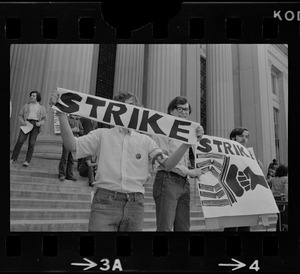 MIT student protesters seen with strike banners on entrance steps