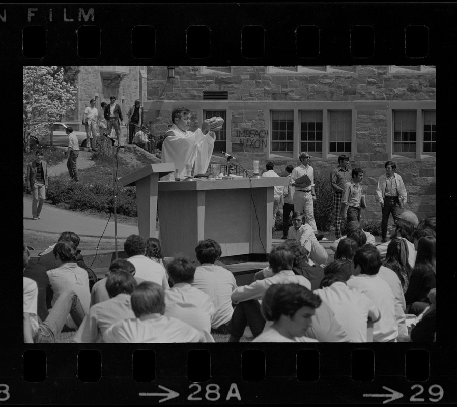 Mass of the Resurrection service is offered at Boston College by Rev. Leo McDonough, S.J., for the four students killed during Kent State University protest