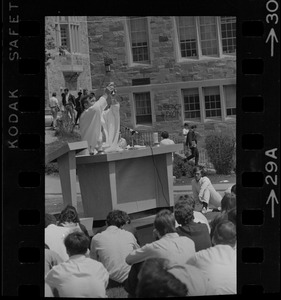 Mass of the Resurrection service is offered at Boston College by Rev. Leo McDonough, S.J., for the four students killed during Kent State University protest