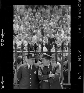 Capitol patrolman stand in front of State House gates during major demonstration at the State House in protest of US march into Cambodia and the Kent State killings