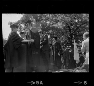 Members of the graduate class of Tufts University receive their degrees