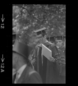 A member of the graduate class of Tufts University receives his degree