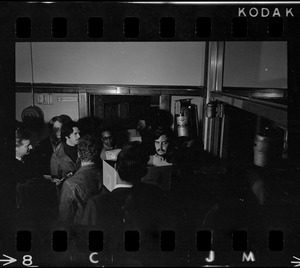 Dim view of group outside Room 101, the office that Boston State College Black students seized in protest