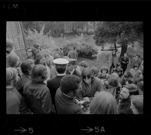 About 100 students block entry of Navy recruiters (white caps) into Alumni Hall at Boston College during protest against Vietnam war