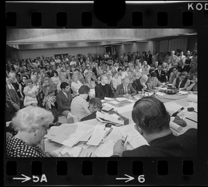 Lewis Weinstein, attorney for Boston College, addresses City Hall hearing with BC President Rev. W. Seavey Joyce at his side