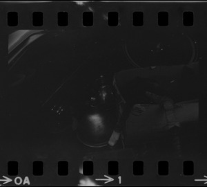 Photographic equipment seen in trunk of a car