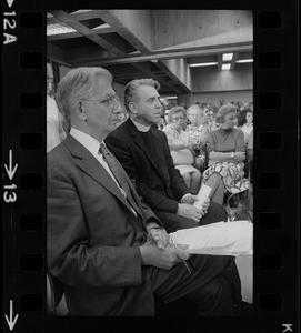 Rev. W. Seavey Joyce, president of Boston College, and Atty. Lewis H. Weinstein in audience at hearing