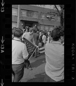 Student protesters grabbed the American flag from an administration building of the National Guard Armory in demonstration to oppose the war and Kent State shootings