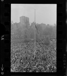 Crowd at State House salute flag at half-mast during student protests against US march into Cambodia and the killing of four Ohio students at Kent State