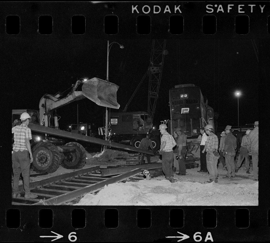 Emergency crew working on track of runaway Penn Central train on Southeast Expressway in South Boston