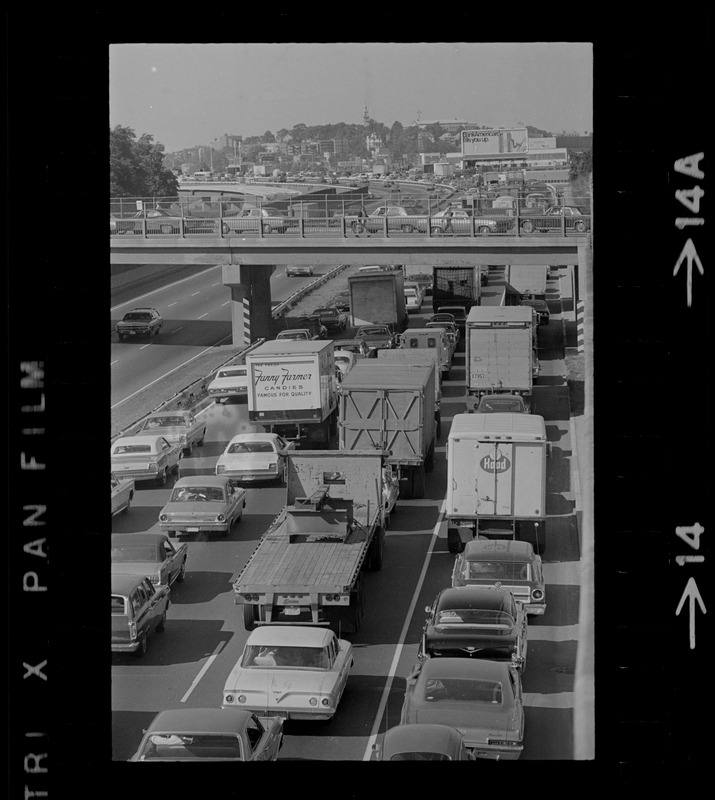 View of traffic in northbound lanes of Southeast Expressway after runway train accident in South Boston