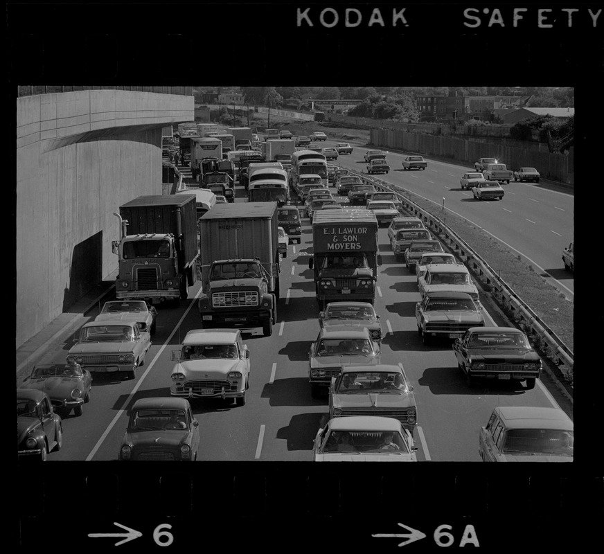 View of traffic in northbound lanes of Southeast Expressway after runway train accident in South Boston