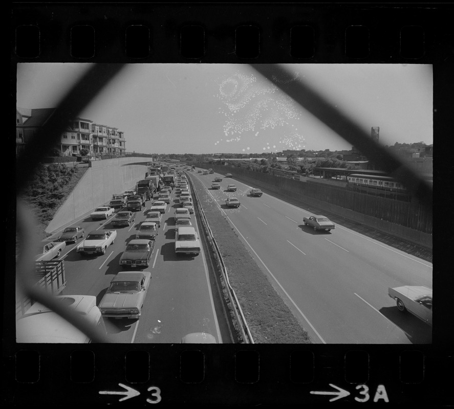 View of traffic in northbound lanes of Southeast Expressway after runway train accident in South Boston