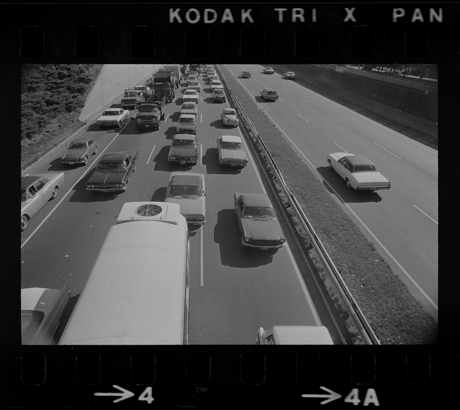 View of traffic in northbound lanes of Southeast Expressway after runway train accident in South Boston