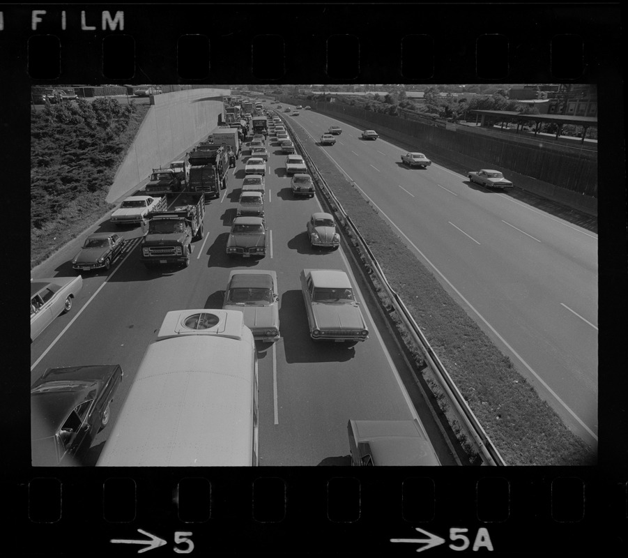 View of traffic in northbound lanes of Southeast Expressway after runway train accident in South Boston