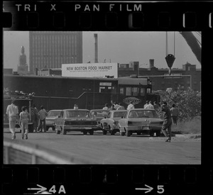 Close up of Penn Central locomotives blocking most of the Northbound lane of the Southeast Expressway in South Boston