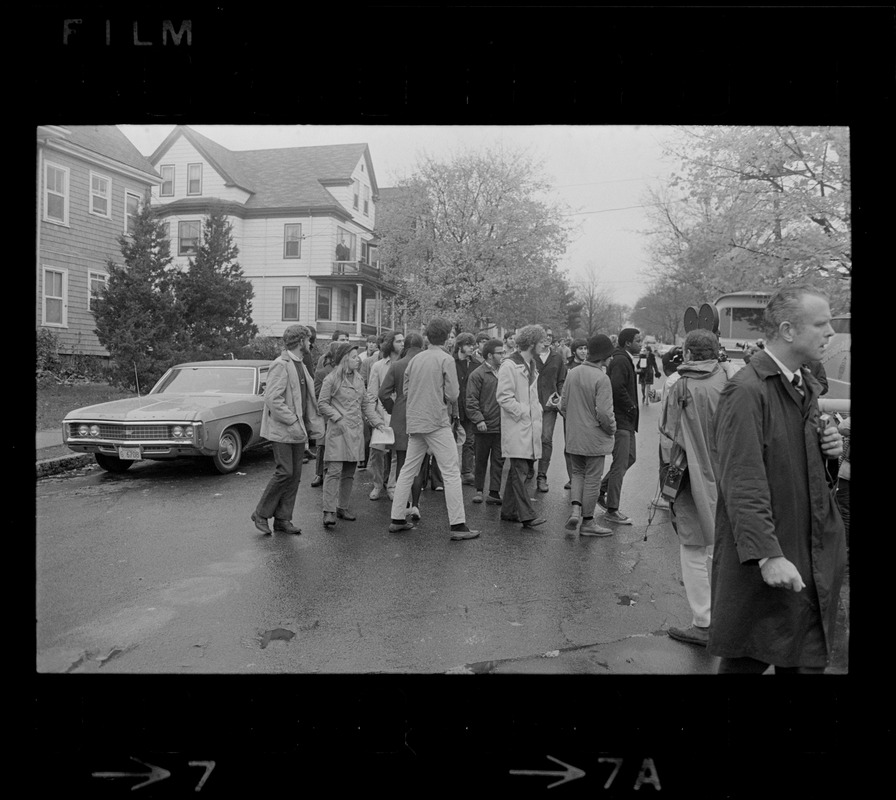 Tufts University students marching to dormitory construction site in protest against hiring practices of construction company