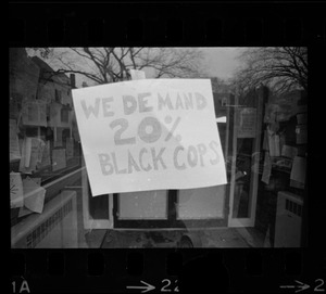 We Demand 20% Black Cops' sign posted in window of Tufts University during student demonstrations