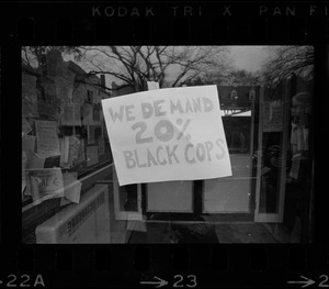 We Demand 20% Black Cops' sign posted in window of Tufts University during student demonstrations