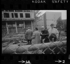 A group of men at the Tufts University dormitory construction site, center of the student opposition