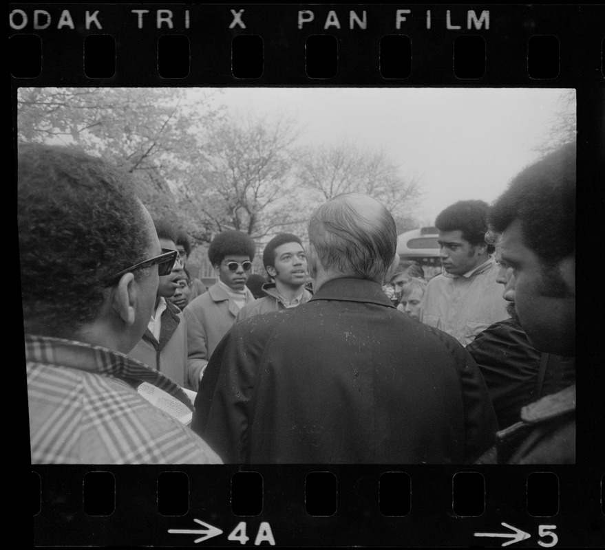 A man speaking to a group of Tufts student protesters