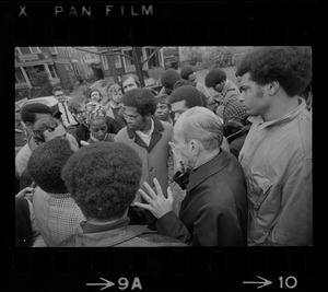 A group including Rev. Robert Drinan, Dean of Boston College Law School and committee chairman of Massachusetts Advisory Committee to the US Civil Rights Commission, being interviewed during Tufts University student protests