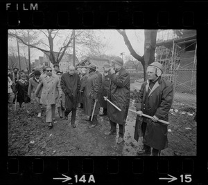 Rev. Robert Drinan walking with a group towards the Tufts University dormitory construction site that is at the center of student opposition