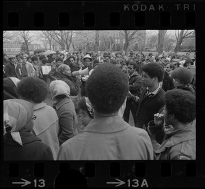 Tufts University student protesters gathered around a speaker
