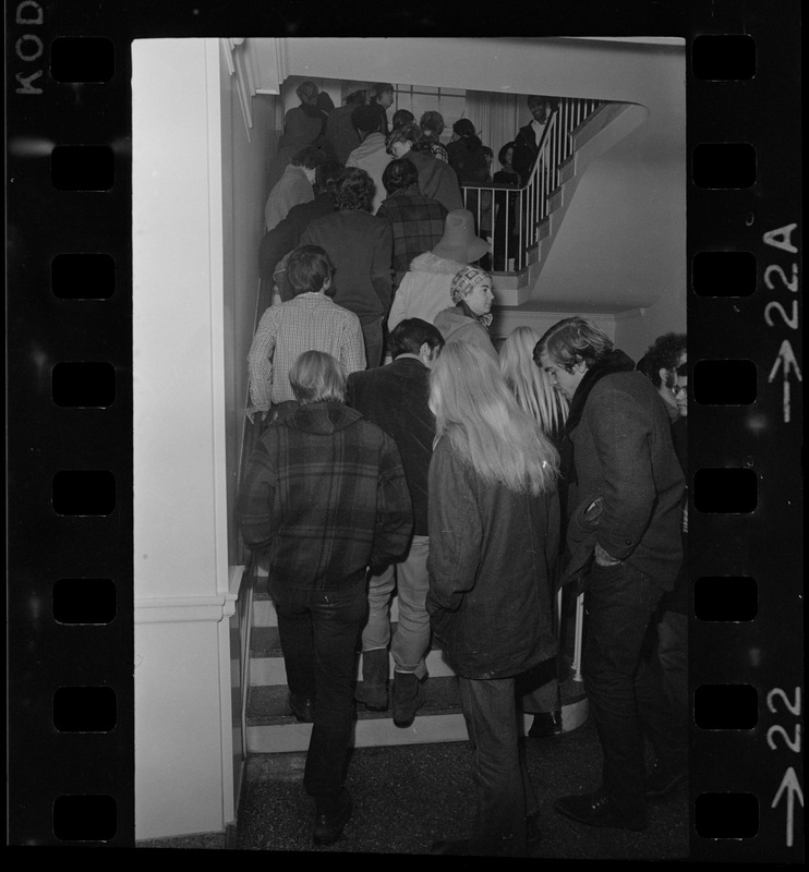 Tufts University students ascending a stairwell during student protest