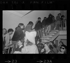 Tufts University students ascending a stairwell during student protest