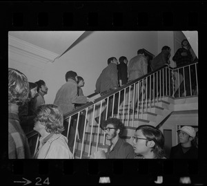 Tufts University students ascending a stairwell during student protest