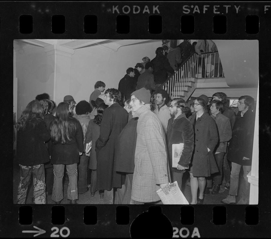 Tufts University students ascending a stairwell during student protest