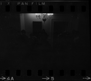 A dim view of a room, most likely Ballou Hall, during Tufts University student protests