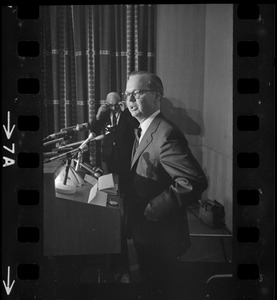 A man speaking from a podium