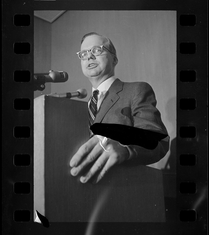 A man speaking from a podium