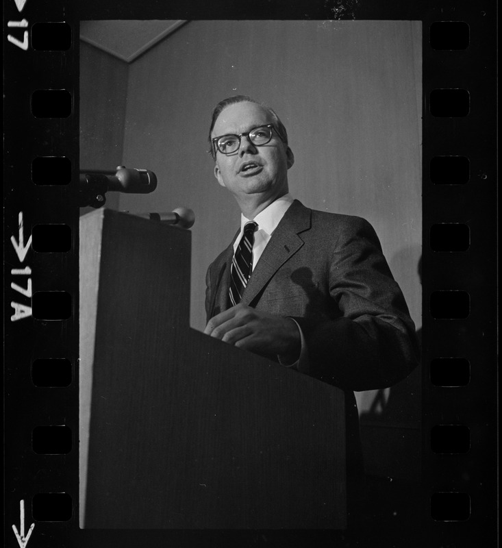 A man speaking from a podium