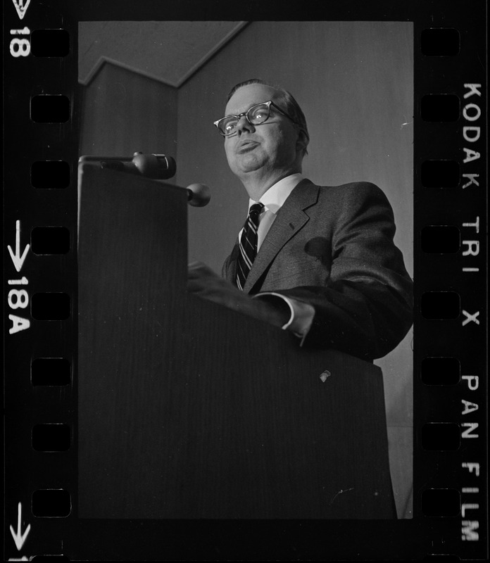 A man speaking from a podium