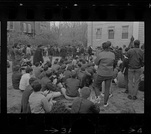 Harvard students gathered behind University Hall, listening to student protesters