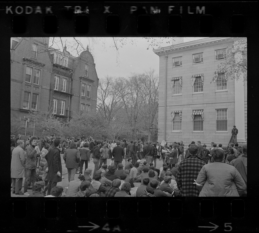 Harvard students gathered behind University Hall, listening to student protesters