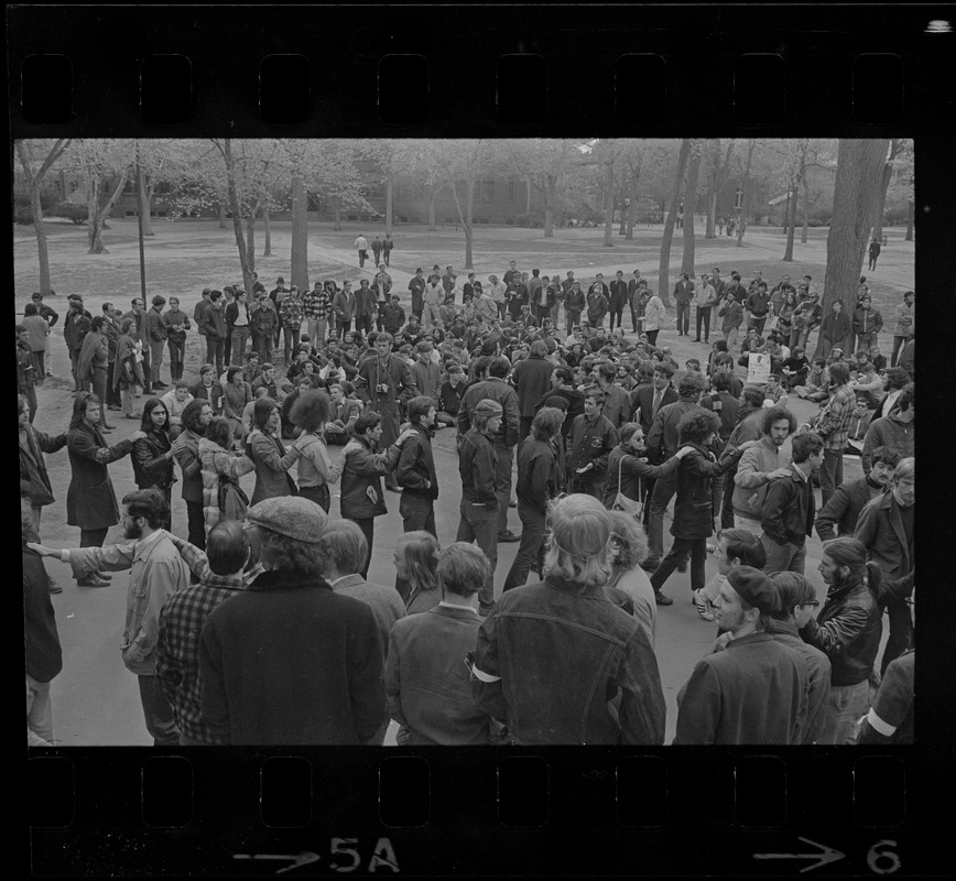 Harvard students, some forming a line, gathered in Harvard Yard in protest