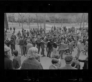 Harvard students, some forming a line, gathered in Harvard Yard in protest