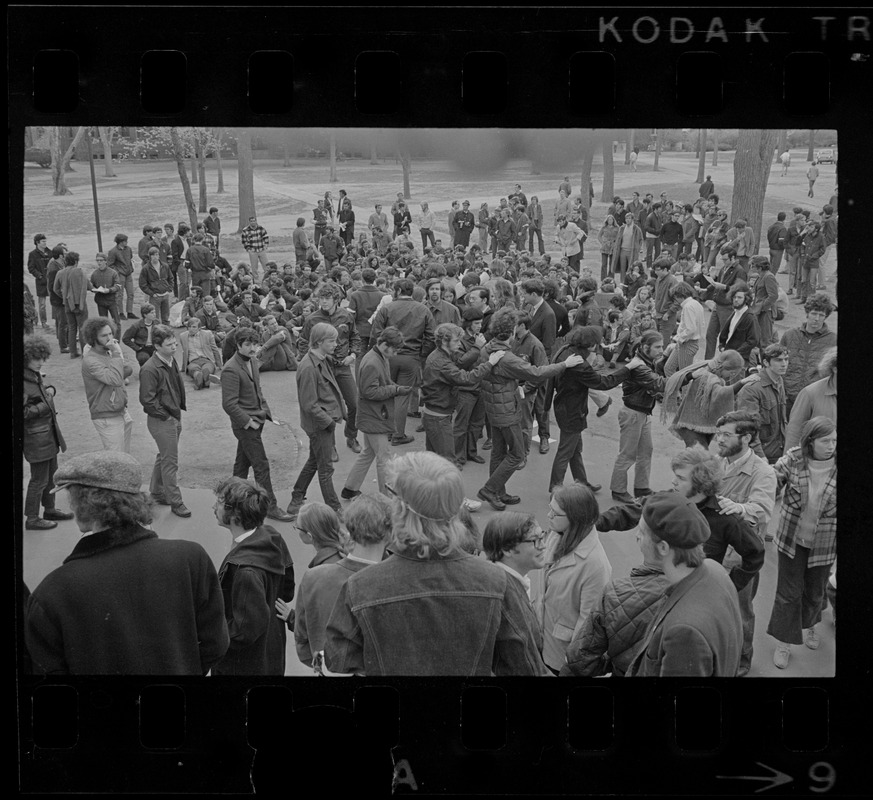 Harvard students, some forming a line, gathered in Harvard Yard in protest