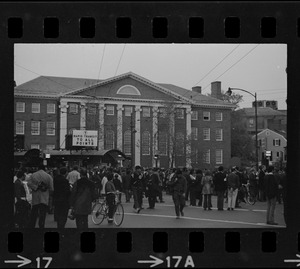 Protesters gathered in Harvard Square, with Lehman Hall seen in the background