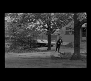A man seen after just he threw an object
