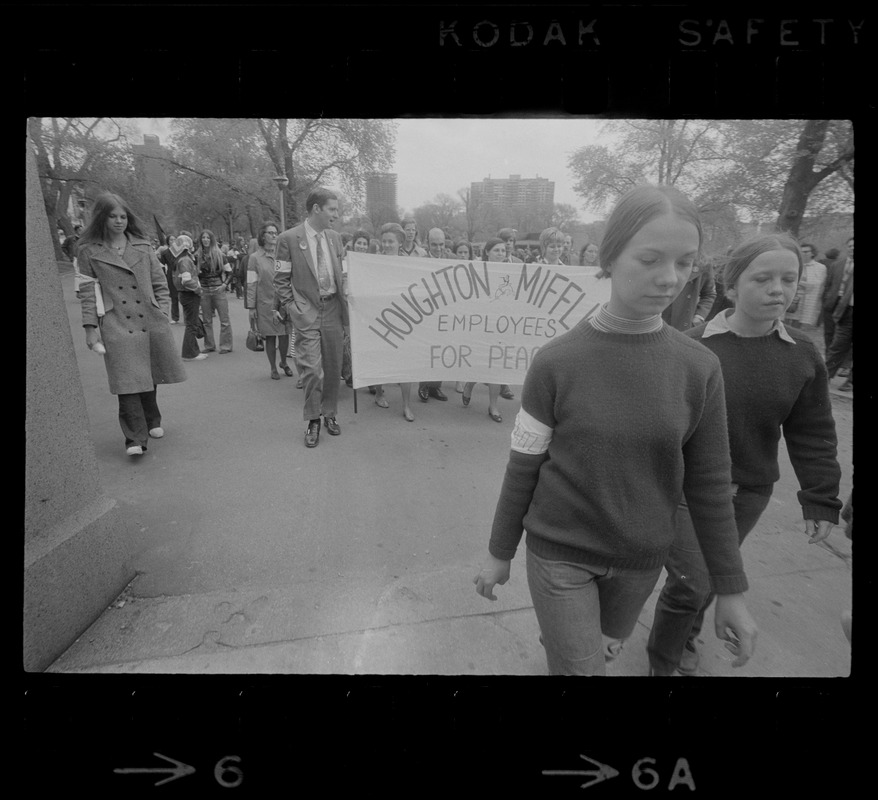 Protesters marching and carrying a 'Houghton & Mifflin Employees for Peace' banner