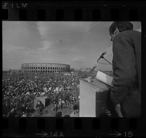 A man speaking to the crowd at a student rally at Soldiers Field