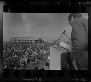 A man speaking to the crowd at a student rally at Soldiers Field