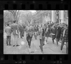 Dean Robert Wilson, center, passes group of Harvard and Radcliffe students demonstrating outside University Hall in Harvard Yard
